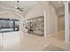 Open-concept living room with tile flooring and access to an outdoor pool at 4401 Arranmore Cir, Valrico, FL 33596