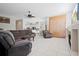 Spacious living room with tile floors, fireplace, and open layout to kitchen at 4401 Arranmore Cir, Valrico, FL 33596