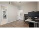 Office space with light walls, wood floors, ceiling fan, and ample desk space at 4401 Arranmore Cir, Valrico, FL 33596