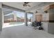 A screened lanai offers ceiling fans and access to an outdoor swimming pool at 4401 Arranmore Cir, Valrico, FL 33596