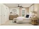 Cozy bedroom with a comfortable bed, stylish mirror, soft lighting, and neutral color scheme at 4511 S Manhattan Ave # 13, Tampa, FL 33611
