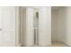 A conveniently located laundry closet with bi-fold doors, a washer, and a dryer at 4511 S Manhattan Ave # 13, Tampa, FL 33611
