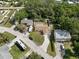 Aerial view displays the neighborhood, a long driveway and RV parking at 4549 Ontario Dr, New Port Richey, FL 34652