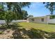Wide view of the well-maintained backyard with a white privacy fence at 4549 Ontario Dr, New Port Richey, FL 34652
