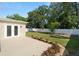 Spacious backyard features a concrete patio and privacy fence at 4549 Ontario Dr, New Port Richey, FL 34652