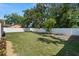 Manicured backyard featuring a white fence that encloses the property at 4549 Ontario Dr, New Port Richey, FL 34652