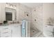 Stylish bathroom featuring marble-look tile, a glass-enclosed shower, and brushed nickel hardware at 4549 Ontario Dr, New Port Richey, FL 34652