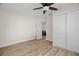 Empty bedroom featuring a ceiling fan, wood-look floors, and closet at 4549 Ontario Dr, New Port Richey, FL 34652
