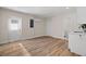 Versatile bonus room features vinyl flooring, a utility sink, and doors leading to an additional room and the exterior at 4549 Ontario Dr, New Port Richey, FL 34652