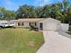 Charming single Gathering home with a well-manicured lawn and driveway at 4549 Ontario Dr, New Port Richey, FL 34652