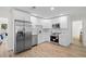 Updated kitchen with sleek white cabinetry, stainless steel appliances, and contemporary design features at 4549 Ontario Dr, New Port Richey, FL 34652