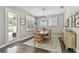 Cozy dining room with wood table, natural light, and access to the outdoor patio at 4918 Lakeshore Oaks Ct, Tampa, FL 33624