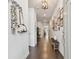 Elegant entryway featuring hardwood floors, decorative artwork, and stylish accents for a welcoming feel at 4918 Lakeshore Oaks Ct, Tampa, FL 33624
