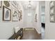 Bright entryway with hardwood floors, bench seating, and stylish decor, offering a warm and inviting welcome at 4918 Lakeshore Oaks Ct, Tampa, FL 33624
