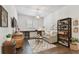 Living room features hardwood floors, a stylish sofa, and a built-in desk at 4918 Lakeshore Oaks Ct, Tampa, FL 33624