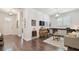 Living room features hardwood floors, white walls, and stylish décor at 4918 Lakeshore Oaks Ct, Tampa, FL 33624