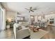 Open concept living room and kitchen with hardwood floors offer space for gathering at 4918 Lakeshore Oaks Ct, Tampa, FL 33624
