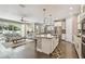 Open-concept living space connects the living room, dining area, and modern kitchen at 4918 Lakeshore Oaks Ct, Tampa, FL 33624