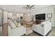 The open-concept living space with a kitchen and living room provides ample room to relax at 4918 Lakeshore Oaks Ct, Tampa, FL 33624