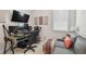 Comfortable office space with a large desk, gaming chair, couch, and natural light at 4918 Lakeshore Oaks Ct, Tampa, FL 33624