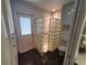 Bright bathroom featuring a glass block wall and exterior door at 50 Water Oak Way, Oldsmar, FL 34677