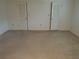 Bedroom featuring neutral carpet and closet space at 50 Water Oak Way, Oldsmar, FL 34677