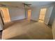 Spacious bedroom featuring neutral carpet, ceiling fan and walk-in closets at 50 Water Oak Way, Oldsmar, FL 34677