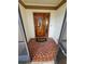 Inviting entryway with a wooden door featuring stained glass and mosaic tile flooring at 50 Water Oak Way, Oldsmar, FL 34677