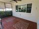 Enjoy the outdoors on this enclosed lanai with tile flooring and ceiling fan at 50 Water Oak Way, Oldsmar, FL 34677