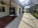 Large enclosed lanai offers ample space for outdoor relaxation and entertainment at 50 Water Oak Way, Oldsmar, FL 34677