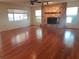 Spacious living room with hardwood floors and a stone fireplace at 50 Water Oak Way, Oldsmar, FL 34677