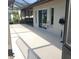 Spacious screened-in patio with views of the yard and lush surroundings, perfect for outdoor relaxation at 50 Water Oak Way, Oldsmar, FL 34677