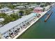 Community aerial view featuring waterfront condos, community pool, and docks at 5042 Coquina Key Se Dr, St Petersburg, FL 33705