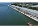 An aerial view showing waterfront condo community with private docks at 5042 Coquina Key Se Dr, St Petersburg, FL 33705
