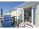 Balcony featuring chairs, table and a view of the interior of the home at 5042 Coquina Key Se Dr, St Petersburg, FL 33705