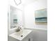 Bright, modern powder room with a vanity, stylish mirror and pleasant decor at 5042 Coquina Key Se Dr, St Petersburg, FL 33705