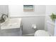 Cozy powder room with a modern vanity, stylish mirror, and fresh decor at 5042 Coquina Key Se Dr, St Petersburg, FL 33705