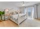 Bedroom featuring a bed with patio doors leading to a balcony with water views at 5042 Coquina Key Se Dr, St Petersburg, FL 33705