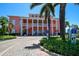 Elegant clubhouse entrance with lush landscaping, providing a welcoming community space at 5042 Coquina Key Se Dr, St Petersburg, FL 33705