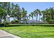 Waterside community entrance with lush landscaping and palm trees creating a welcoming view at 5042 Coquina Key Se Dr, St Petersburg, FL 33705