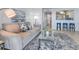Comfortable living room features a plush sofa, stylish rug, and tasteful decor for a cozy ambiance at 5042 Coquina Key Se Dr, St Petersburg, FL 33705