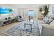 Comfortable living room leads to an outdoor patio overlooking the ocean, perfect for relaxing at 5042 Coquina Key Se Dr, St Petersburg, FL 33705