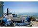 Inviting patio with comfortable seating and a fire pit, overlooking a beautiful serene ocean view at 5042 Coquina Key Se Dr, St Petersburg, FL 33705