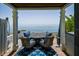 Outdoor patio showcasing a table and chairs, providing a relaxing space with an ocean view at 5042 Coquina Key Se Dr, St Petersburg, FL 33705