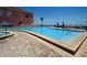 Inviting swimming pool with a brick-paved deck and ocean views, perfect for enjoying the sun at 5042 Coquina Key Se Dr, St Petersburg, FL 33705