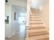 Bright stairway featuring wood and white risers and modern design at 5042 Coquina Key Se Dr, St Petersburg, FL 33705