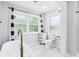 Elegant bathroom featuring a freestanding tub and modern fixtures at 5632 Indiana Ave, New Port Richey, FL 34652