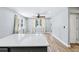 Bright dining area with large windows and quartz countertops at 5632 Indiana Ave, New Port Richey, FL 34652