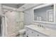 Modern bathroom with a glass-enclosed shower, vanity, and white marble at 6021 Bahia Del Mar Cir # 239, St Petersburg, FL 33715