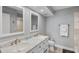 Stylish bathroom with double sinks, marble countertops, and neutral-toned walls at 6021 Bahia Del Mar Cir # 239, St Petersburg, FL 33715